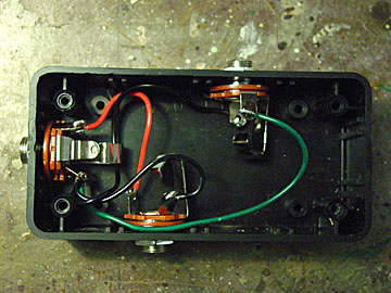 This is the inside of the Rick-o-Sound box -- stereo jack on the left, wired to two mono jacks.